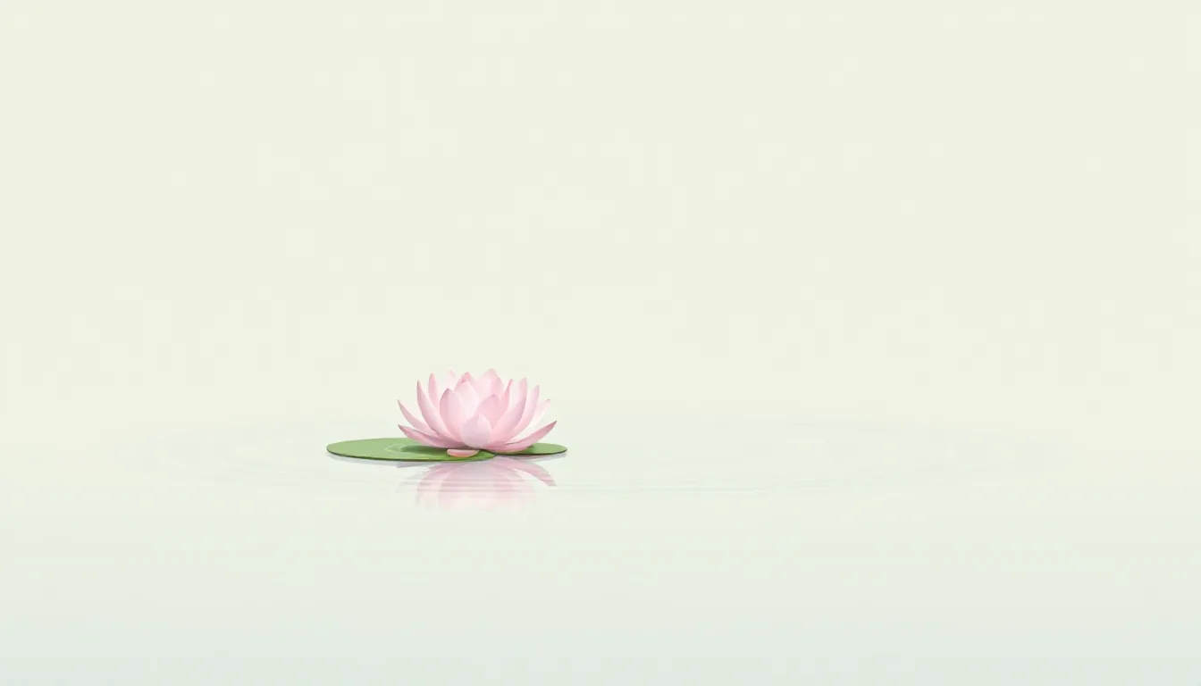 A single lotus flower floating on still water against an empty background